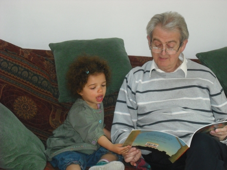 Barrie reading with his granddaughter Hannah